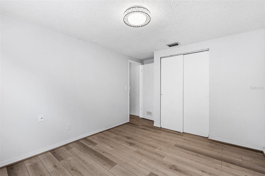 10187 122nd Avenue Largo, FL 33773 - Photo 35 of 48 a view of room with wooden floor