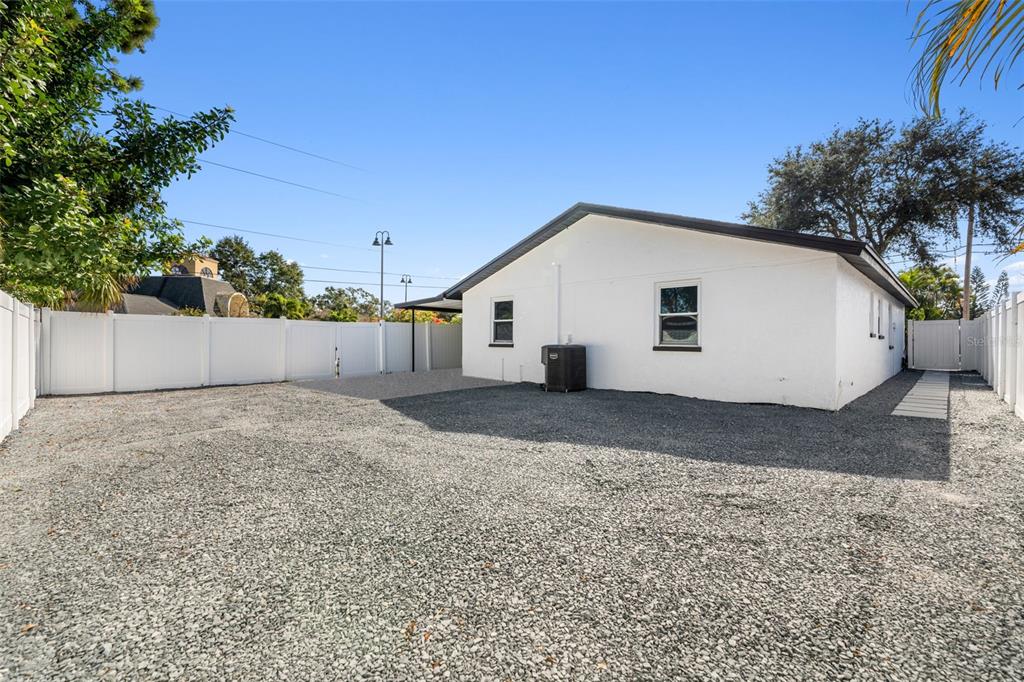 10187 122nd Avenue Largo, FL 33773 - Photo 40 of 48 a view of a white house with a yard