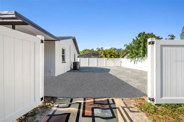 a view of a house with a backyard