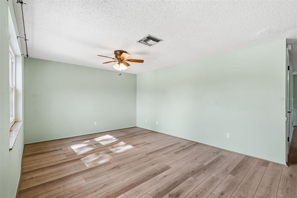 10187 122nd Avenue Largo, FL 33773 - Photo 6 of 48 a view of a room with wooden floor