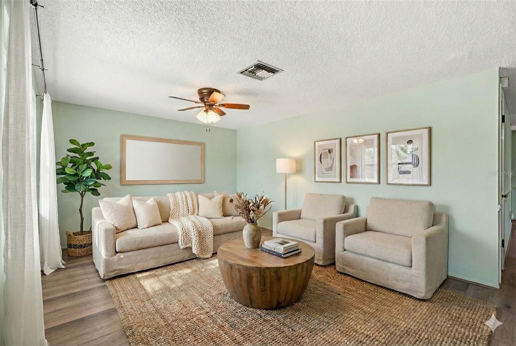 10187 122nd Avenue Largo, FL 33773 - Photo 7 of 48 a living room with furniture and a potted plant