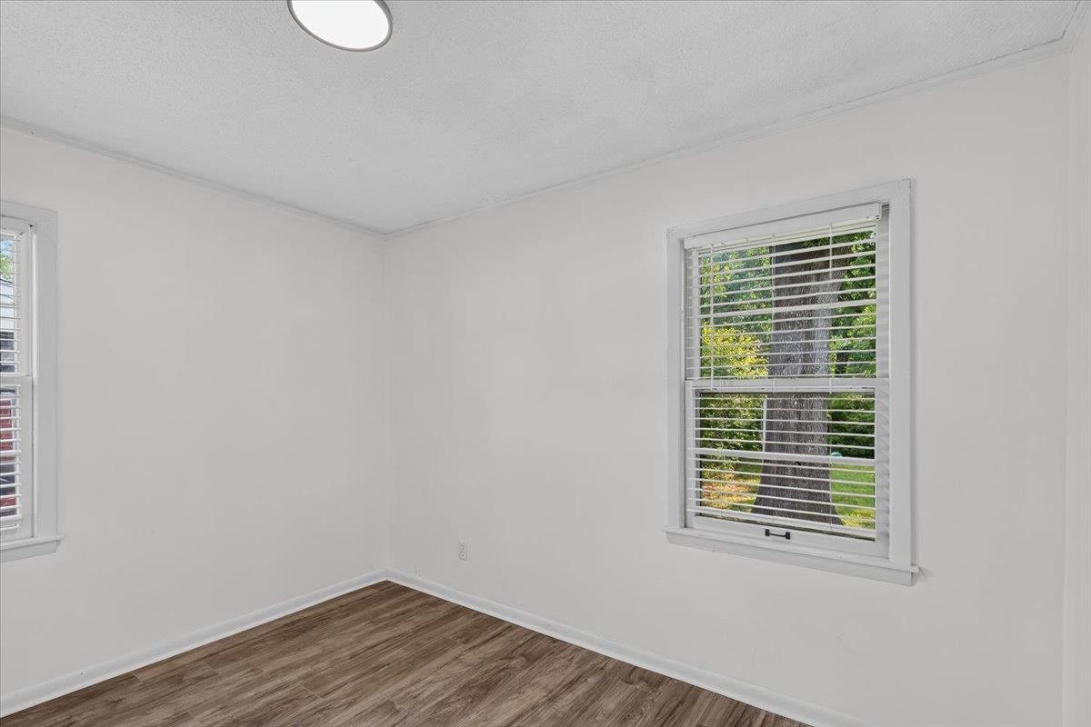 2717 Merle Street Memphis, TN 38118 - Photo 11 of 18 Interior room featuring wood-finish flooring, white walls, and white trim