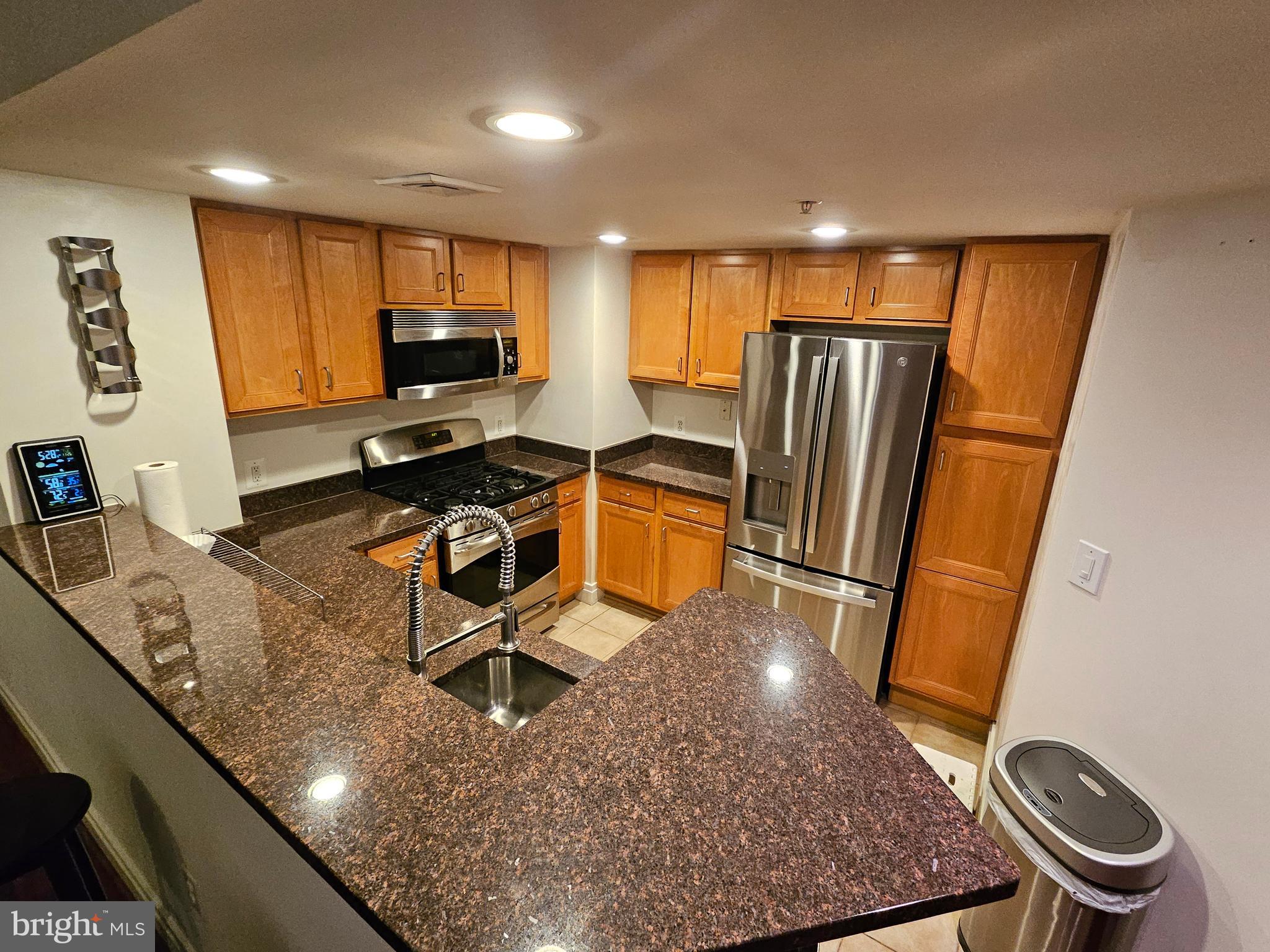 414 Water Street, Unit 2613 Baltimore, MD 21202 - Photo 11 of 42 a room with wooden floor pool table and stainless steel appliances