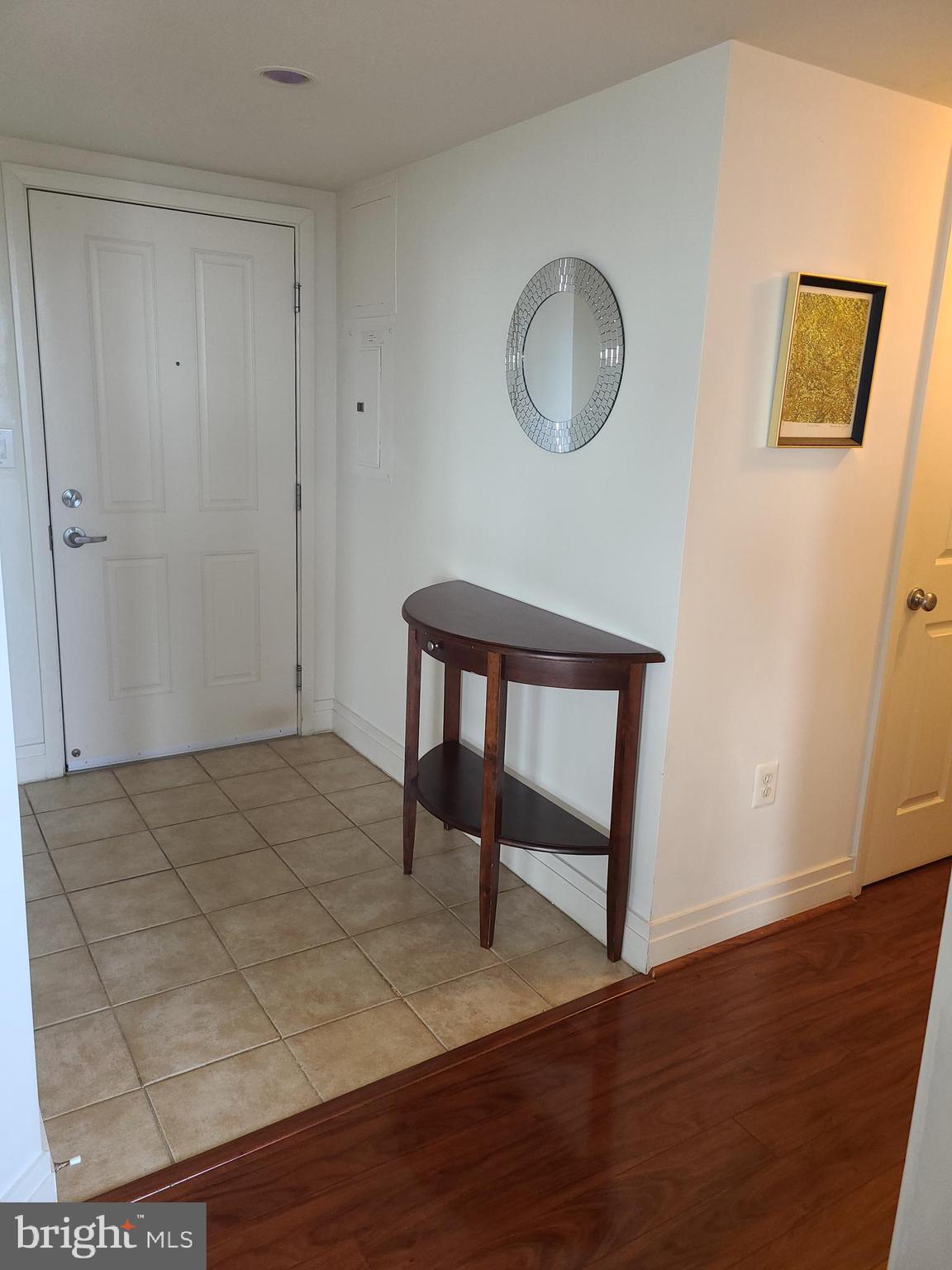 414 Water Street, Unit 2613 Baltimore, MD 21202 - Photo 23 of 42 a view of a room with wooden floor and window