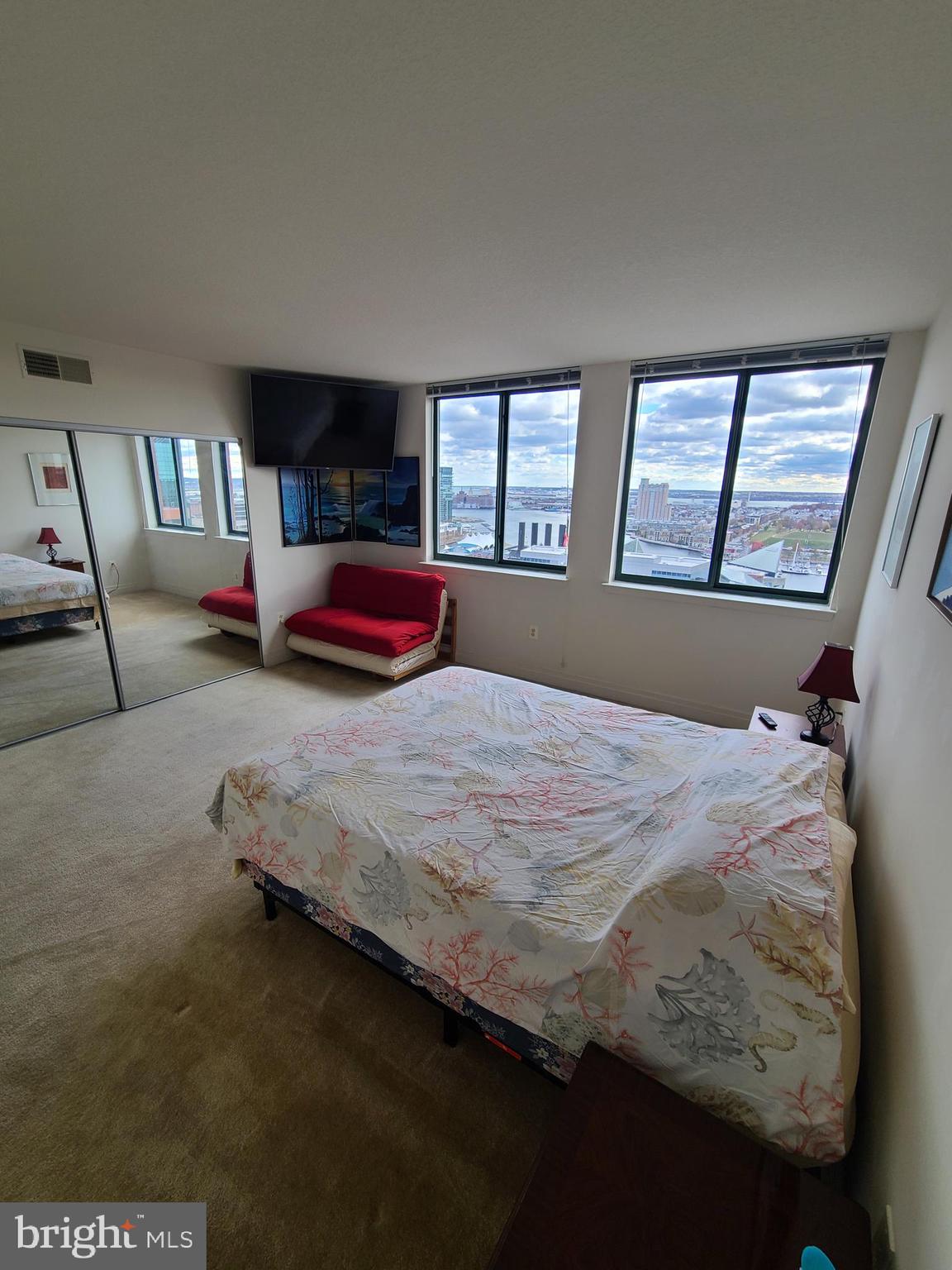 414 Water Street, Unit 2613 Baltimore, MD 21202 - Photo 24 of 42 a bedroom with bed and window