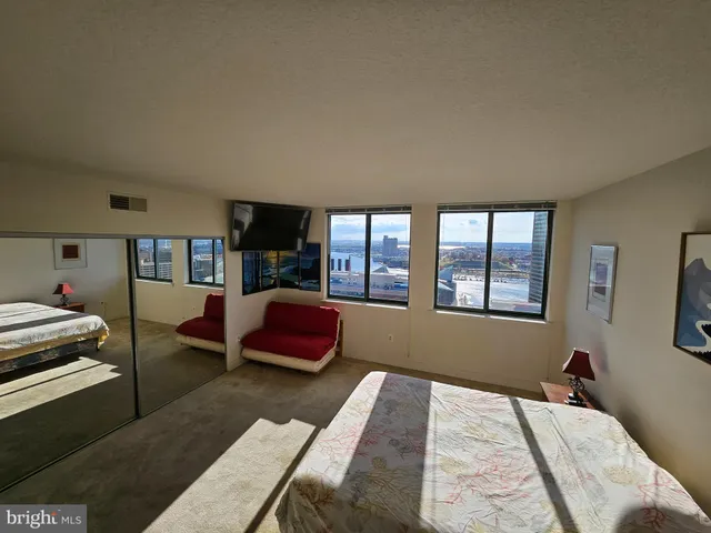 a bedroom with furniture and a window