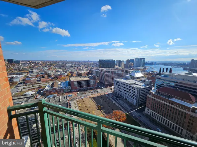a view of a balcony with wooden floor