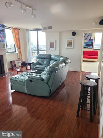 a living room with furniture rug and window