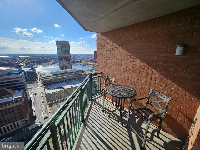 a view of a balcony with chairs