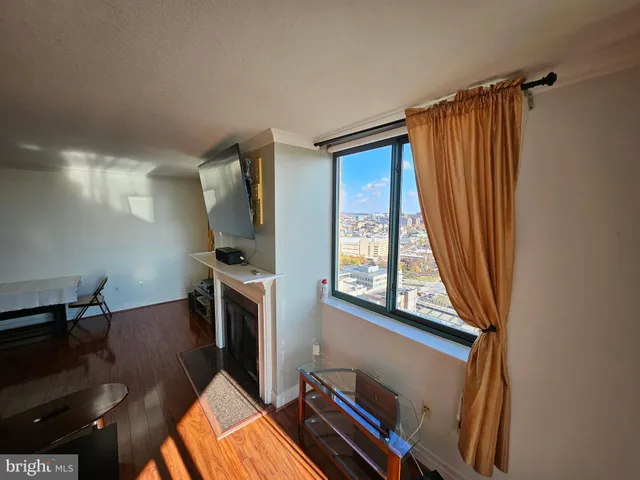 a view of a livingroom with furniture and a window