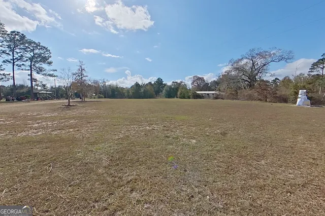 a view of an ocean beach and mountain