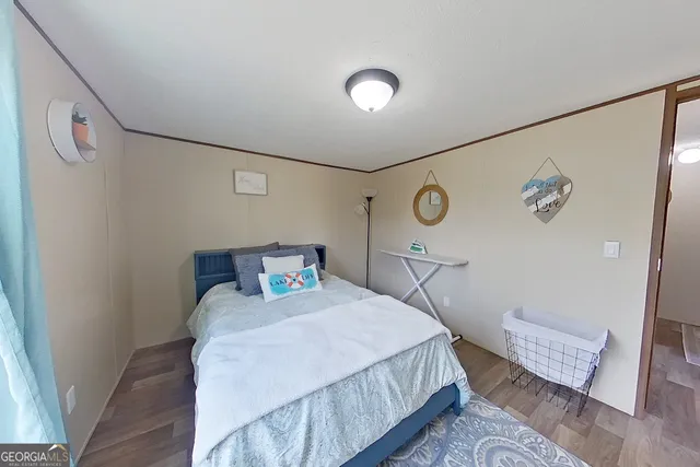 a bedroom with a bed and a table in it