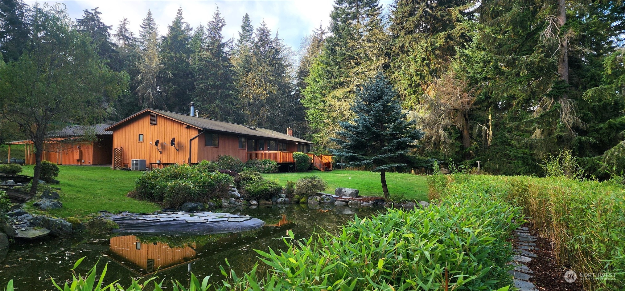 1230 Devries Road Oak Harbor, WA 98277 - Photo 30 of 39 a backyard of a house with lots of green space