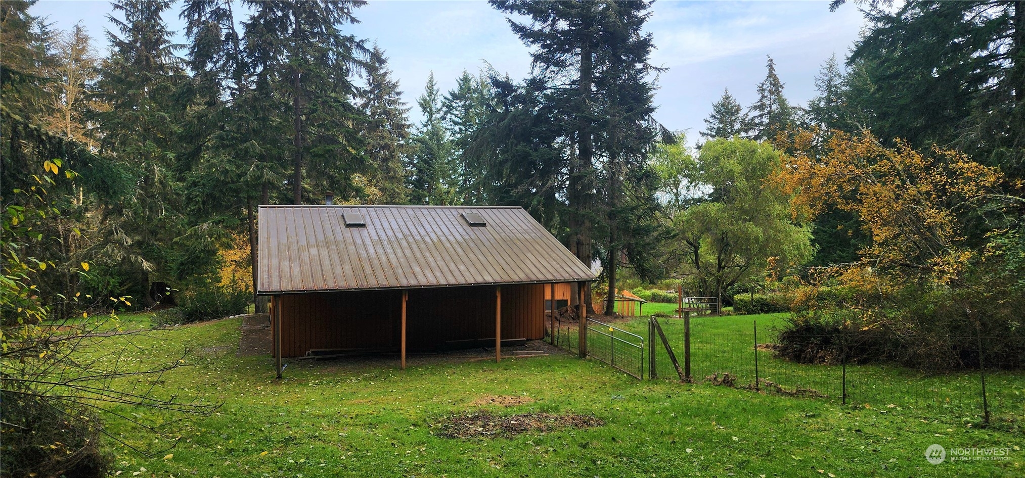 1230 Devries Road Oak Harbor, WA 98277 - Photo 35 of 39 a view of a barn in the middle of a yard