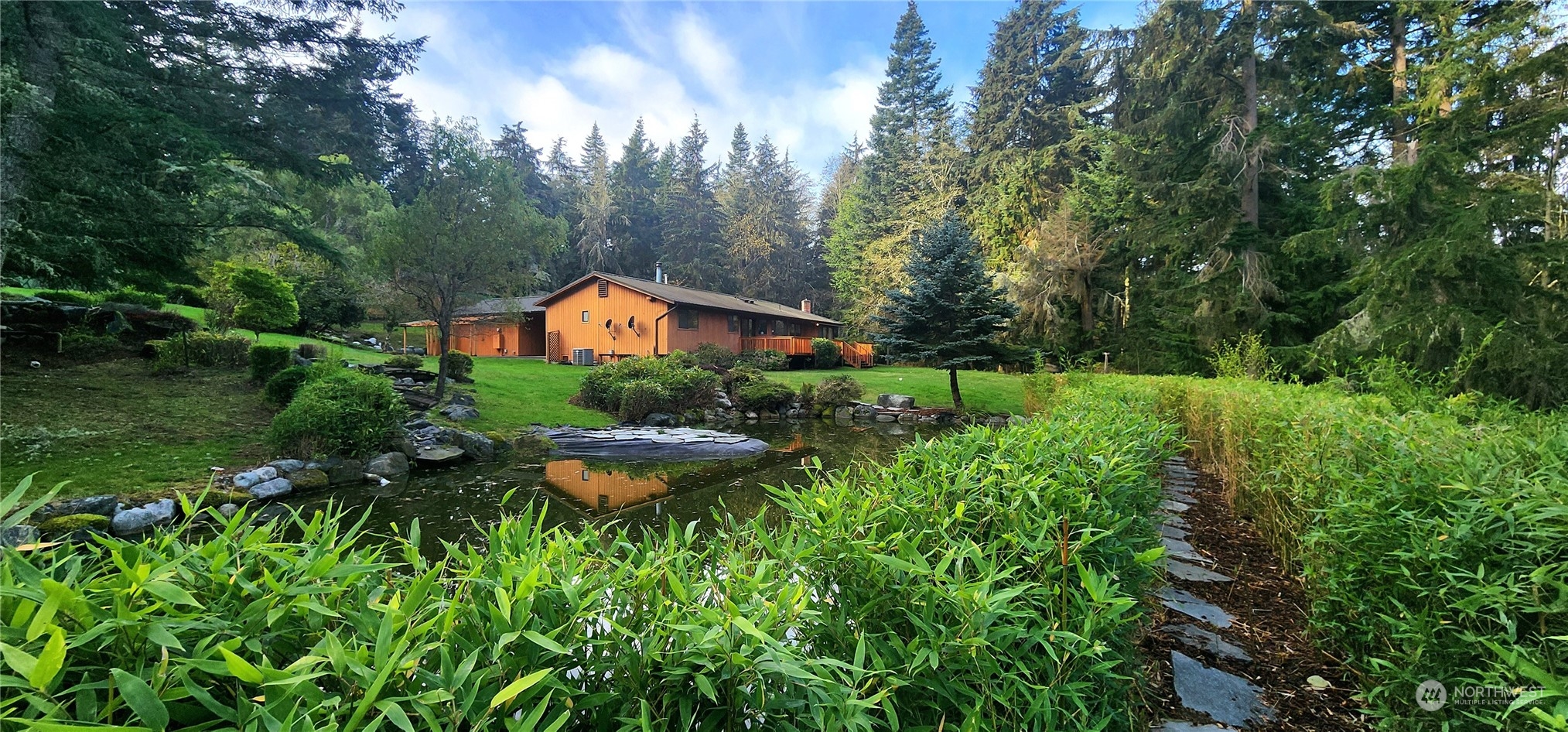 1230 Devries Road Oak Harbor, WA 98277 - Photo 39 of 39 a aerial view of a house with swimming pool a yard and lake view