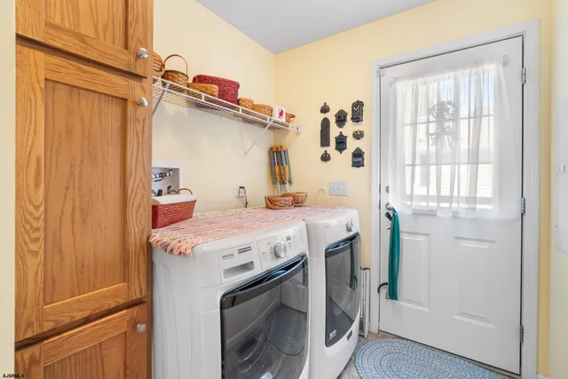 a utility room with dryer and washer