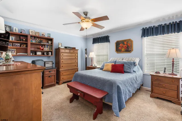 a bedroom with a bed and furniture