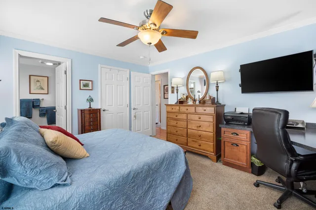 a bedroom with a bed and a chair