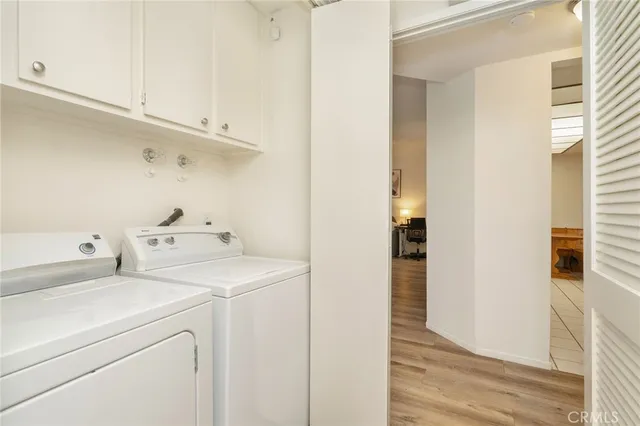 a view of storage and utility room with washer and dryer