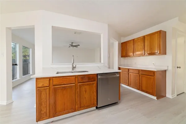 a spacious bathroom with a sink double vanity and a mirror