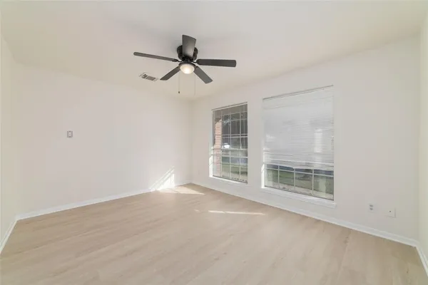 a view of empty room with windows