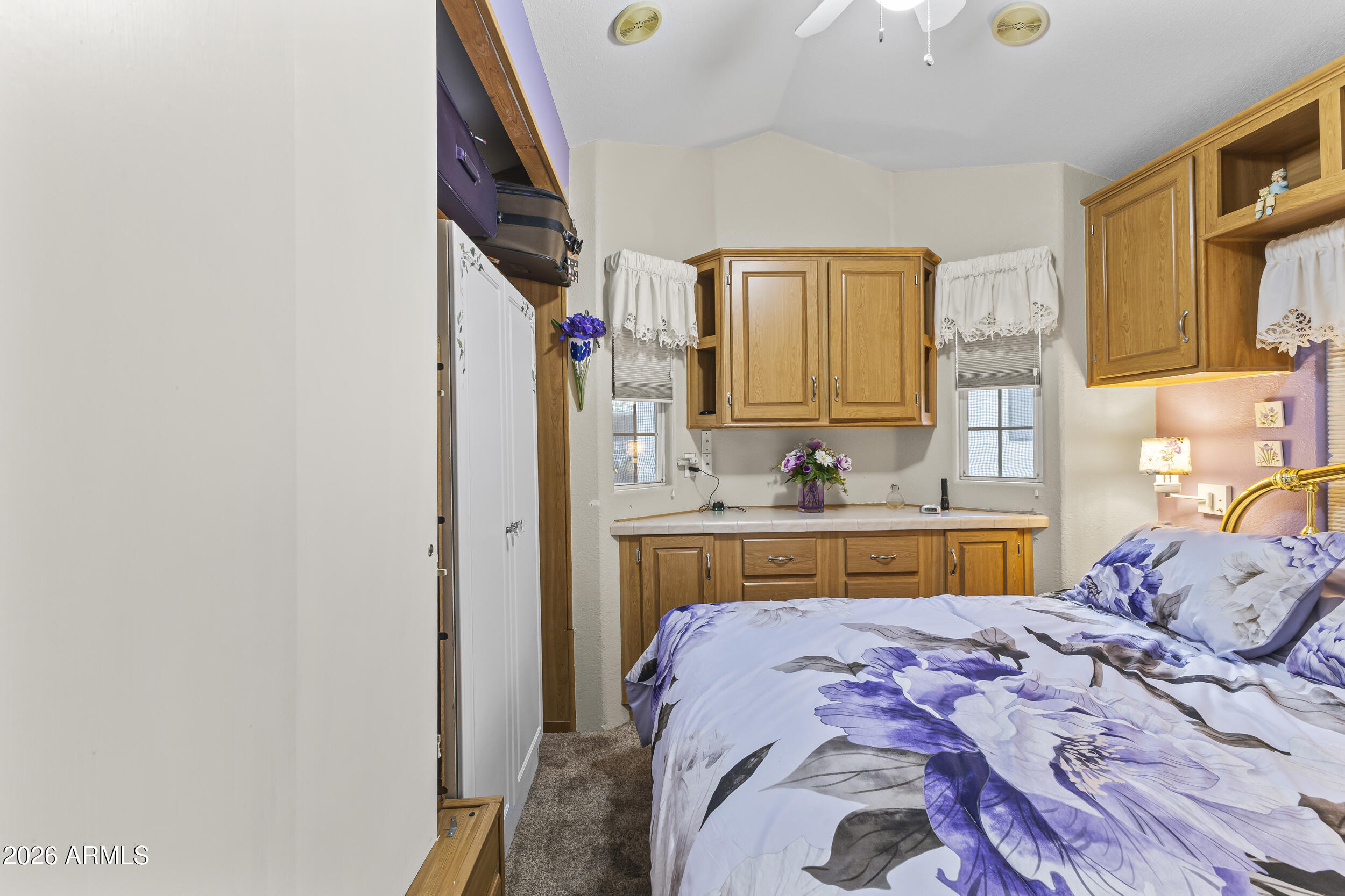 17200 West Bell Road, Unit 548 Surprise, AZ 85374 - Photo 11 of 19 a bed room with a bed and a sink