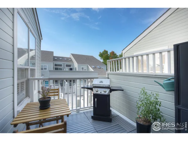 a balcony view with a seating space