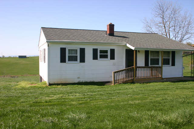4816 Port Republic Road Harrisonburg, VA 22801 - Photo 2 of 7 a front view of a house with a yard