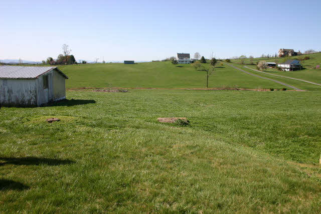 4816 Port Republic Road Harrisonburg, VA 22801 - Photo 7 of 7 a view of a lush green outdoor space with a building in the background