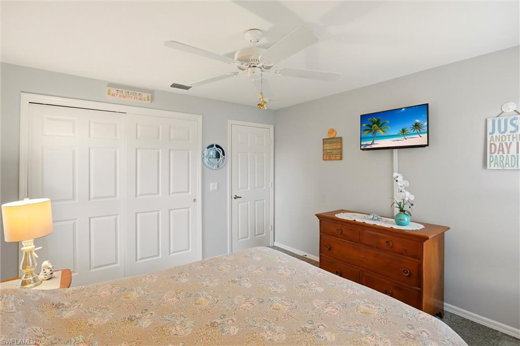 218 Marseille Drive Naples, FL 34112 - Photo 18 of 34 a bedroom with furniture and a window