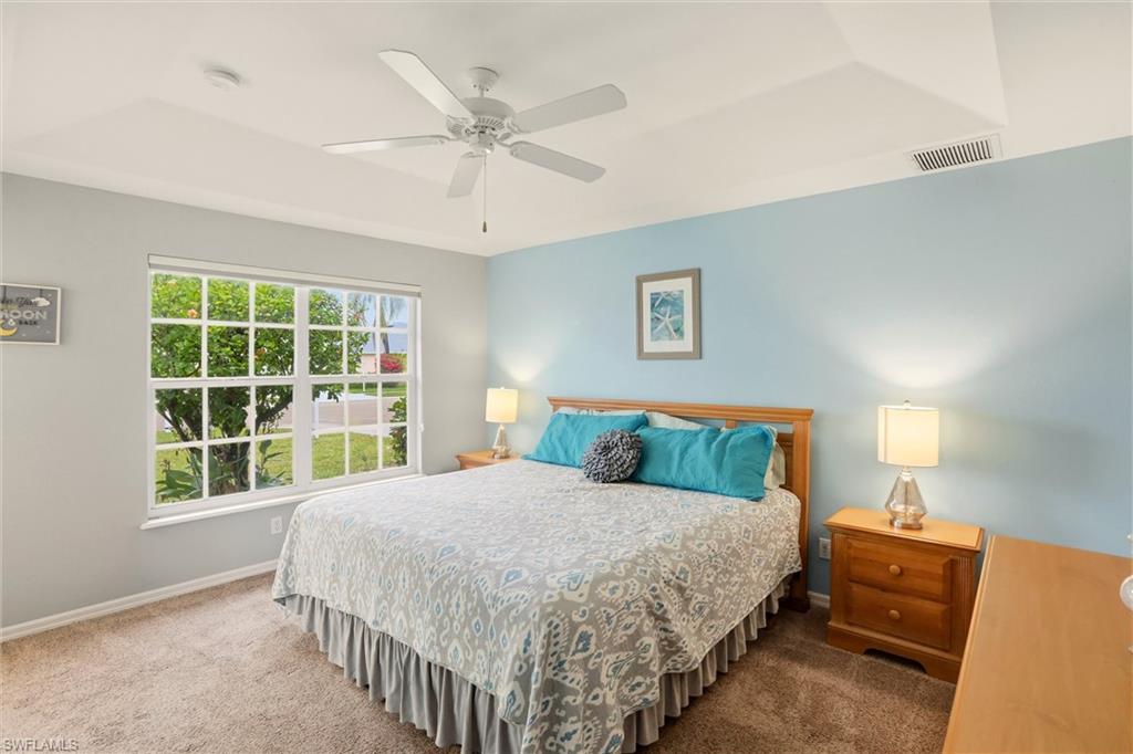 218 Marseille Drive Naples, FL 34112 - Photo 23 of 34 a bedroom with a large bed and a window