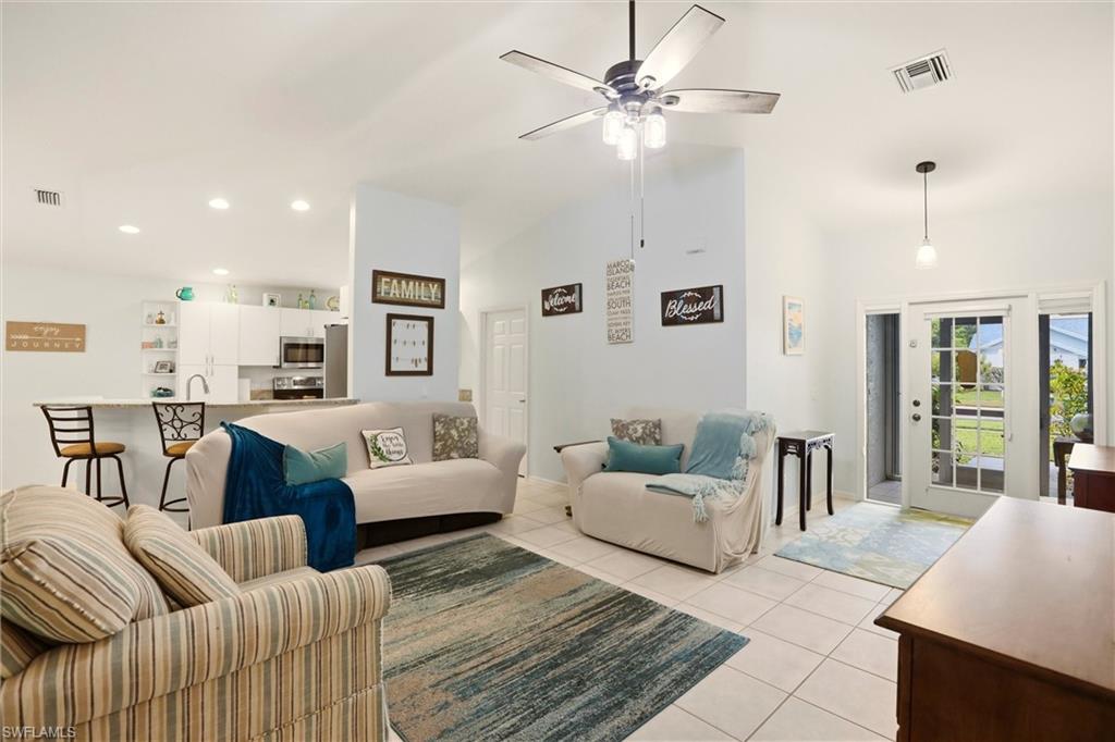 218 Marseille Drive Naples, FL 34112 - Photo 5 of 34 a living room with furniture and a large window