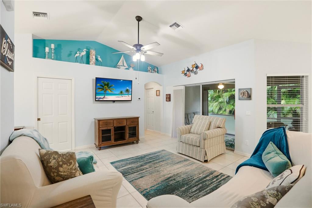 218 Marseille Drive Naples, FL 34112 - Photo 7 of 34 a living room with furniture fireplace and window