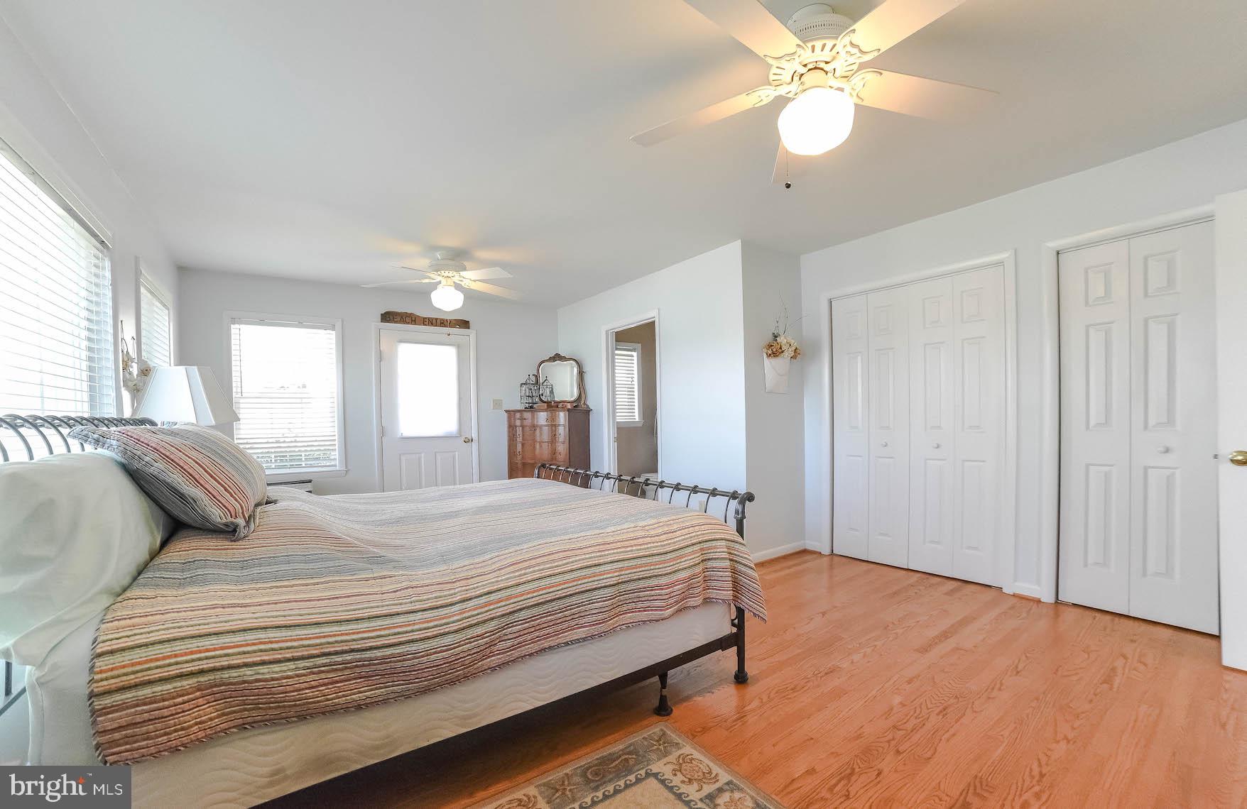 24496 Half Pone Point Road Hollywood, MD 20636 - Photo 36 of 53 Primary bedroom with hardwood floors , double fans