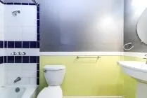 a bathroom with a bathtub and toilet