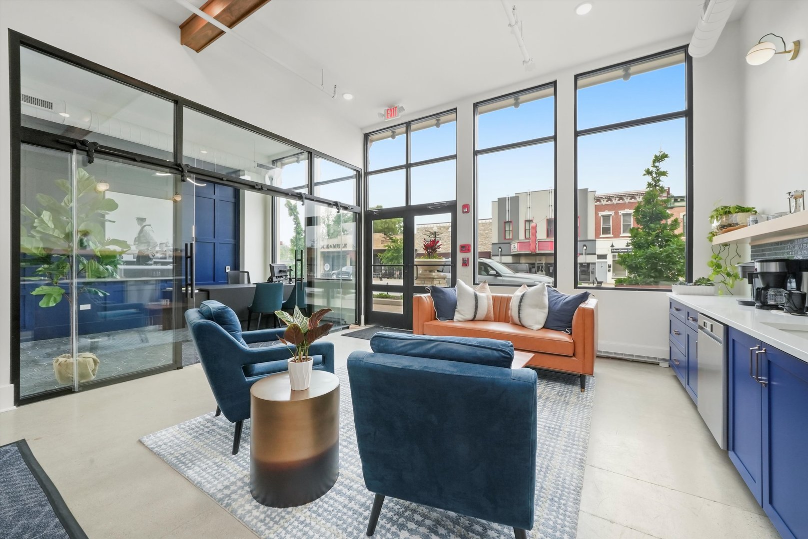 a living room with couch a large window