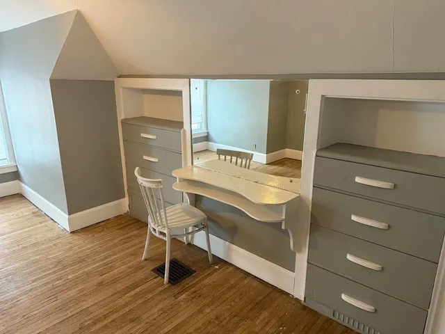 a view of entryway with a room and wooden floor