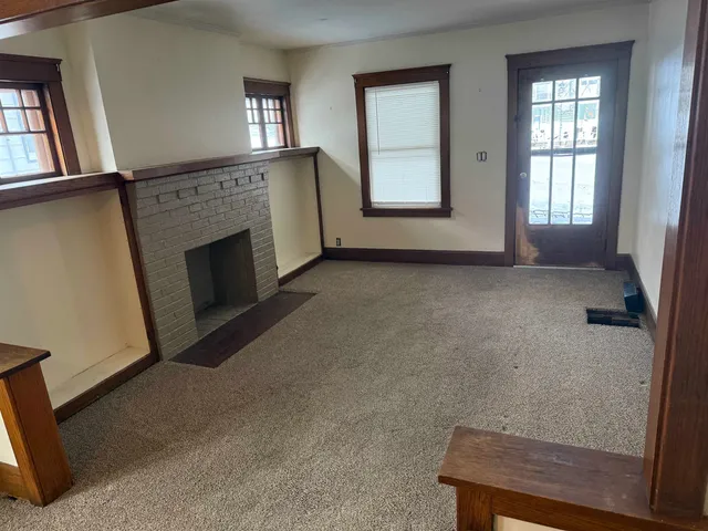 a kitchen with a sink a stove and cabinets