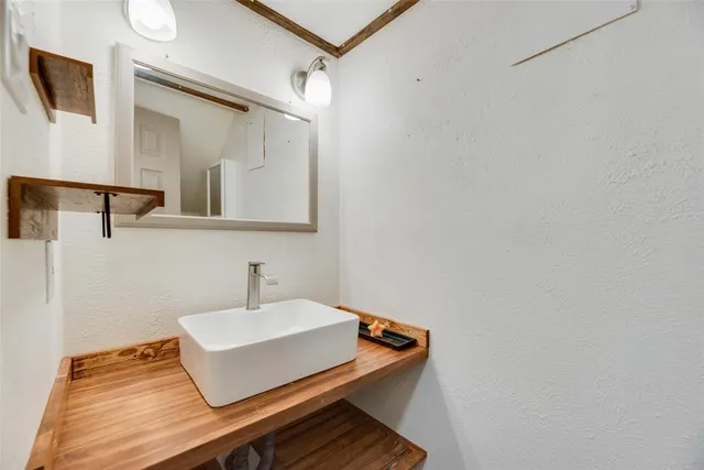 a white cabinet with a sink