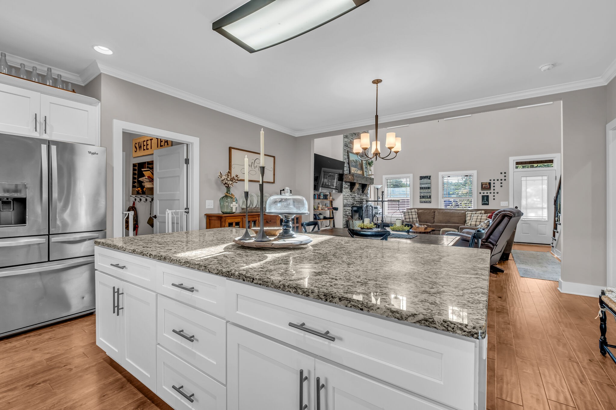 1399 Hamilton Chambers Road Lebanon, TN 37087 - Photo 14 of 40 a view of center island wooden floor and kitchen view