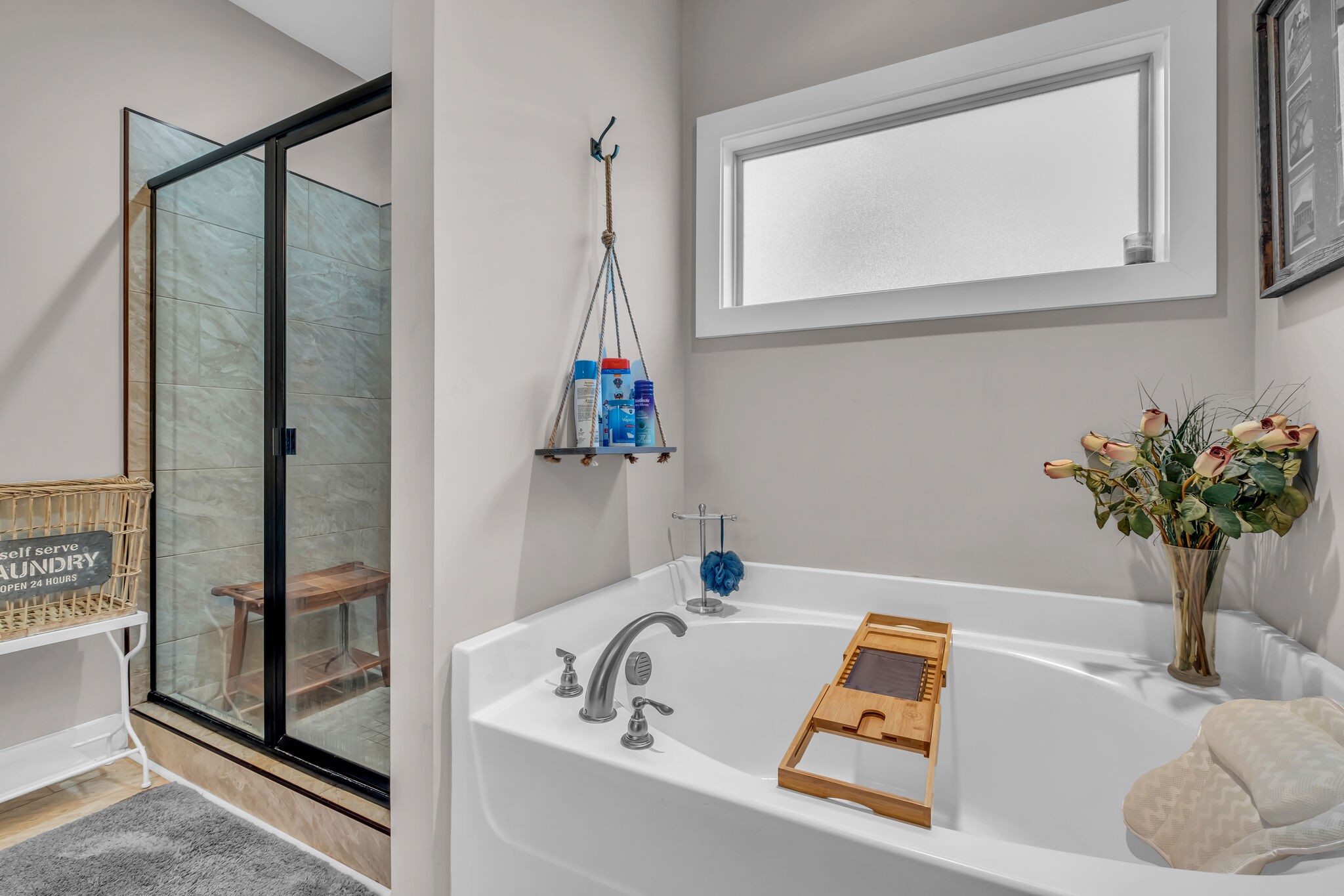 1399 Hamilton Chambers Road Lebanon, TN 37087 - Photo 19 of 40 a bath tub sitting next to a blue sink and a window