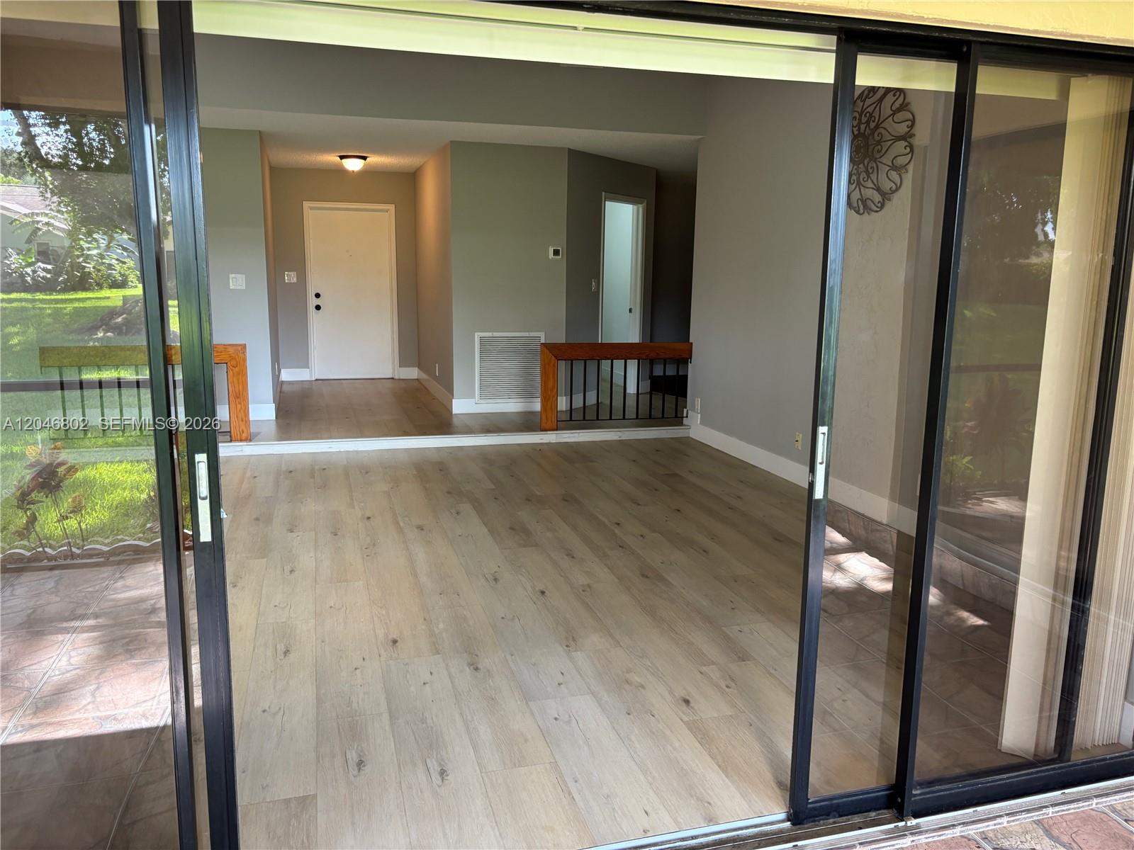 18052 South 105th Avenue South, Unit 18052 Boca Raton, FL 33498 - Photo 24 of 54 family room view from patio