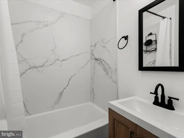 a bathroom with a sink and a bathtub