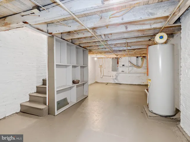 a view of an empty room with white walls