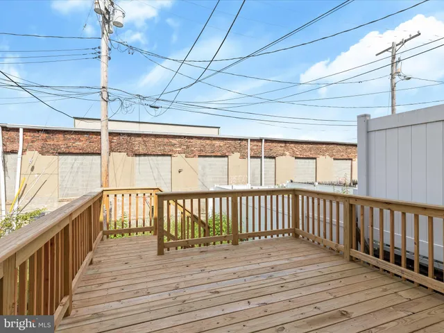 a view of a balcony with wooden floor