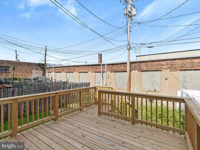 a view of a balcony with wooden floor