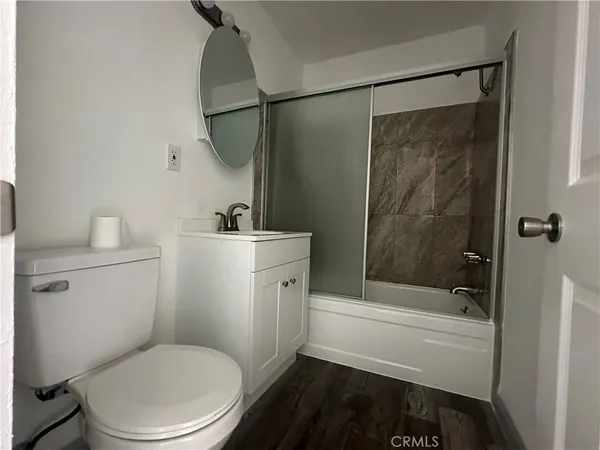 a bathroom with a toilet a sink and bathtub