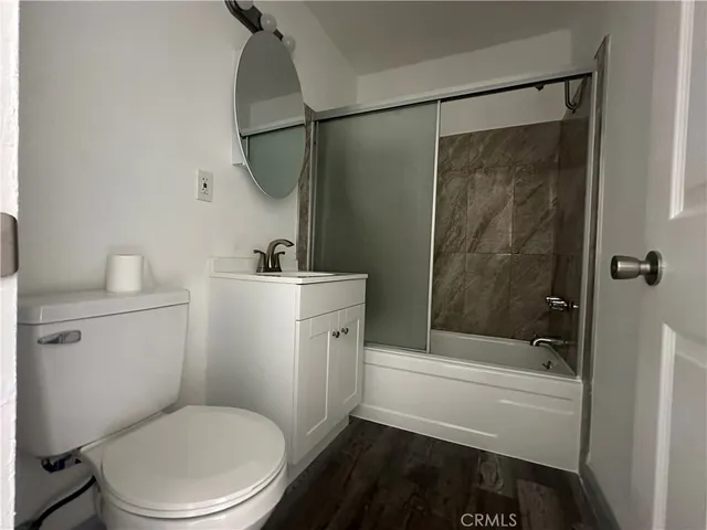 a bathroom with a toilet a sink and bathtub