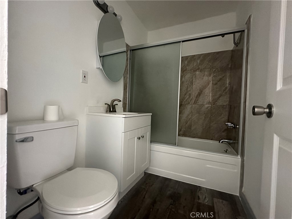 3060 Vineland Avenue, Unit 7 Baldwin Park, CA 91706 - Photo 7 of 14 a bathroom with a toilet a sink and bathtub