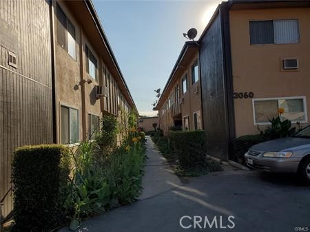 3060 Vineland Avenue, Unit 7 Baldwin Park, CA 91706 - Photo 10 of 14 a view of a car parked in front of a house